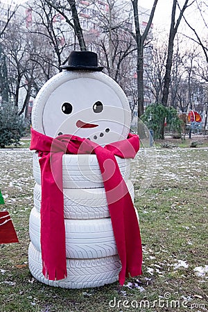 Snowman made by tire car. Stock Photo