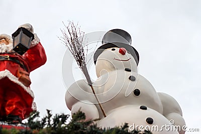 Snowman statue on the roof as part of Christmas decorations Stock Photo