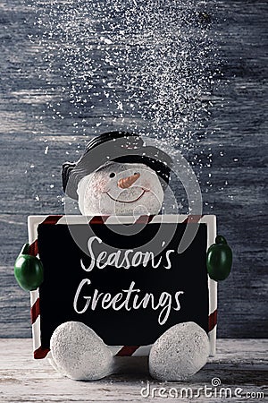 Snowman and text seasons greetings Stock Photo