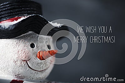 Snowman and text we wish you a merry christmas Stock Photo