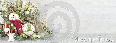 Snowman under a fir branch Stock Photo