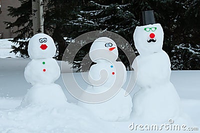 A snowman and woman family in the colorado Winter Stock Photo