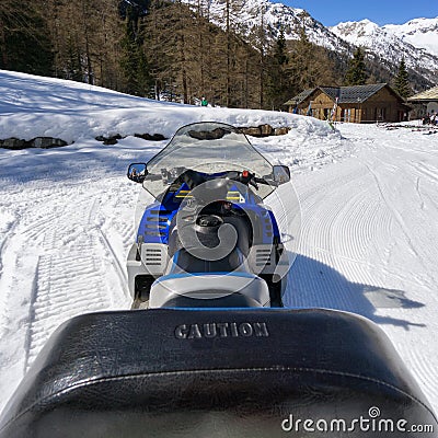 Snowmobile in high mountan with snow Stock Photo