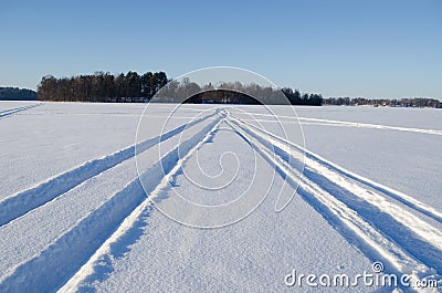 Snowmobile winter transport marks frozen lake snow Stock Photo