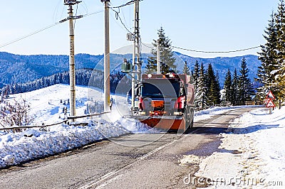 Snowplow clearing road Stock Photo