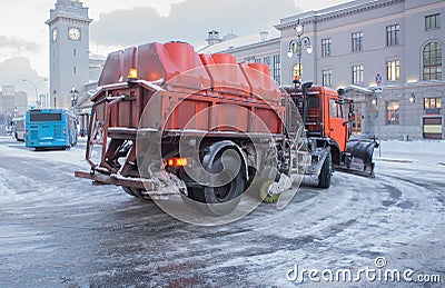 Snowplow removes snow Stock Photo