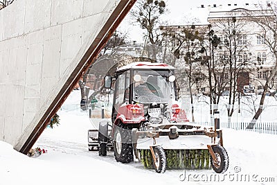 Snowplow removing snow from road in Lviv Editorial Stock Photo
