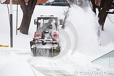 Snowplow removing snow from road in Lviv Editorial Stock Photo