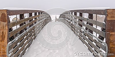 Snowy bridge overlooking winter landscape in Utah Stock Photo