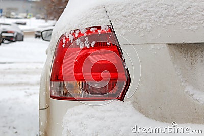 Snowy car tail light. Safety on winter roads Stock Photo