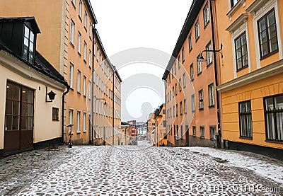 Snowy cobbled street of traditional buildings in Sodermalm, Stockholm, Sweden. Editorial Stock Photo