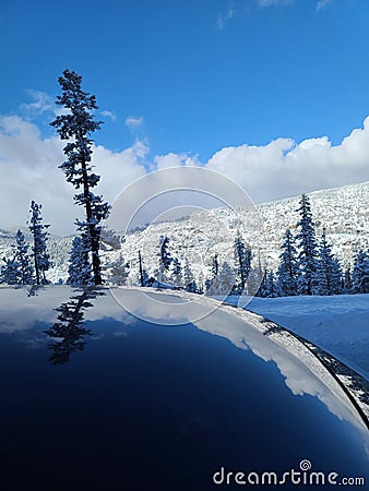 Snowy Drive Reflections Stock Photo