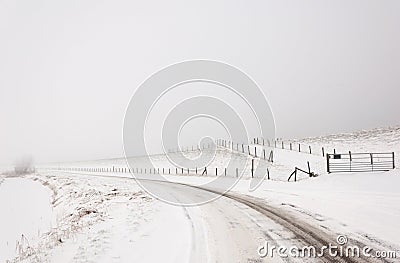 A snowy Dutch landscape with a curved road Stock Photo