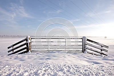 Snowy fence in the Netherlands Stock Photo