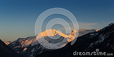 Snowy mount bleispitze at sunset sun Stock Photo