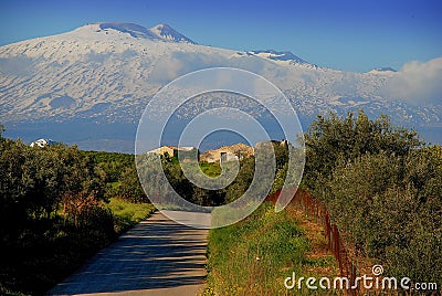 Snowy Mount Etna seen from the countryside surrounding the town of Centuripe Stock Photo