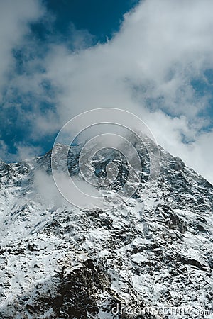 Snowy Mountain Himalayas peaks landscape of Moon Peak, Indarhar pass, Dhauladhar Range cloudy sky Stock Photo