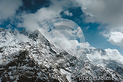 Snowy Mountain Himalayas peaks landscape of Moon Peak, Dhauladhar Range cloudy sky Stock Photo