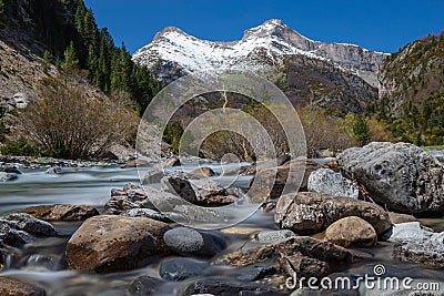 The Snowy Mountains & the river rocks Stock Photo