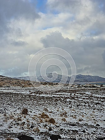 Snowy mountains and wintry pastures Stock Photo