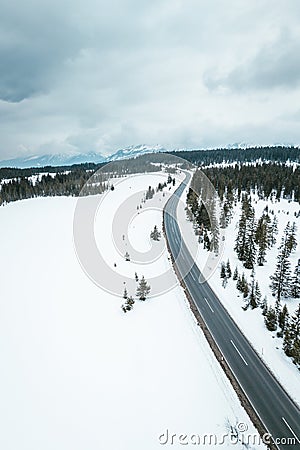 Snowy Road through the Austrian alps Stock Photo