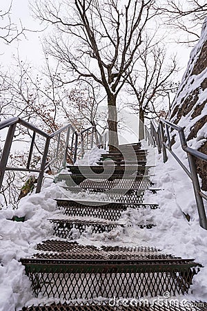 Snowy stairs covered in winter at the park Stock Photo