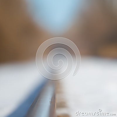 Snowy straight railroad track - low depth of field and pretty blurred bokeh - near the Minnesota River and near Black Dog coal po Stock Photo