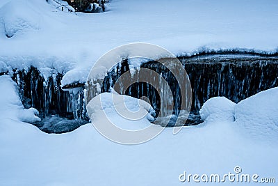 Snowy stream frozen water closeup Stock Photo