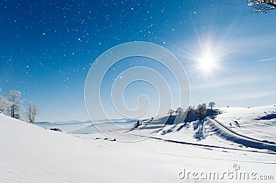 Snowy valley at the top of the mountain Stock Photo