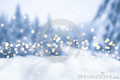 Snowy winter christmas bokeh background with lights and trees Stock Photo