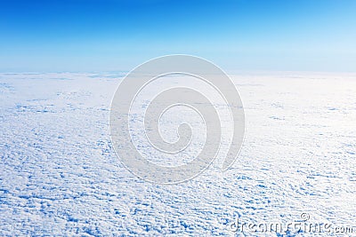 Snowy winter endless field with blue sky. Arctic landscape. Stock Photo
