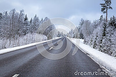 Snowy winter road in the south of Sweden Stock Photo