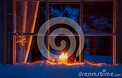 Snowy Wooden Window, Christmas Decoration and Candles Stock Photo