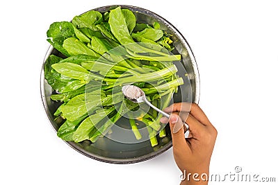 Soak vegetable in water with salt to remove pesticides residues Stock Photo