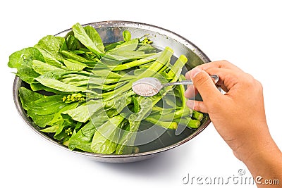 Soak vegetable in water with salt to remove pesticides residues Stock Photo