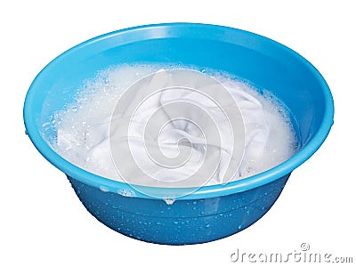 Soak whites clothes in the enameled bowl on white background Stock Photo