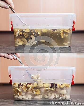 Soaking nuts. Girl shows dirty seeds. Chemical processing of food. Digestive problems are caused by intolerance peanuts, allergies Stock Photo