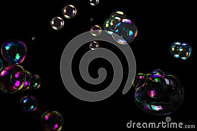 Soap bubbles isolated on a black background Stock Photo