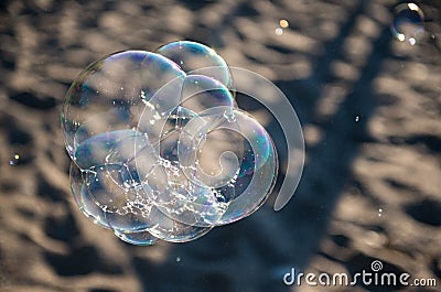 Soap Bubbles on Sandy Beach Stock Photo