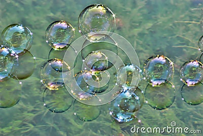 Soap bubbles on water Stock Photo