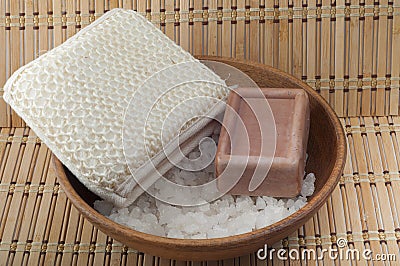 Soap, sea salt in a wooden bowl cleansers Stock Photo