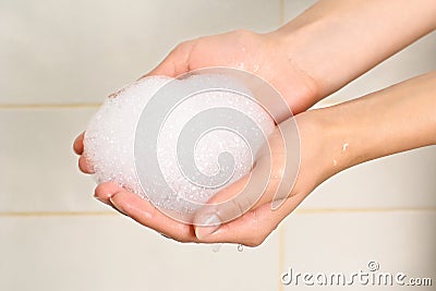 Soap suds in palms Stock Photo
