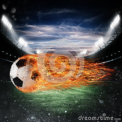 Soccer ball of fire at the stadium Stock Photo