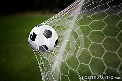 Soccer ball in goal Stock Photo