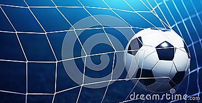 Soccer ball in goal Stock Photo