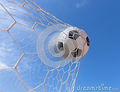 Soccer ball in goal Stock Photo