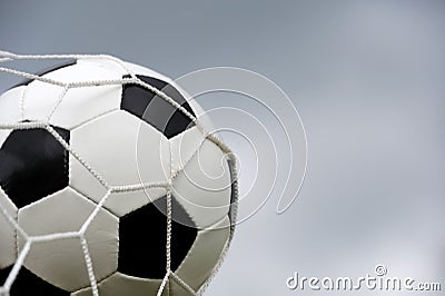 Soccer ball in goal Stock Photo