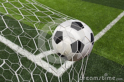 Soccer ball in goal Stock Photo