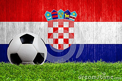 Soccer ball on grass with Croatia flag background Stock Photo