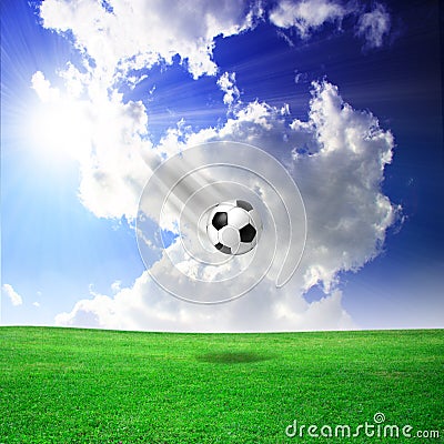 Soccer ball, green field, heaven Stock Photo